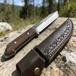 High-hardness outdoor adventure straight knife, with leather blade cover, essential hand-forged knife for wilderness survival. Super sharp blade with anti-slip wooden handle